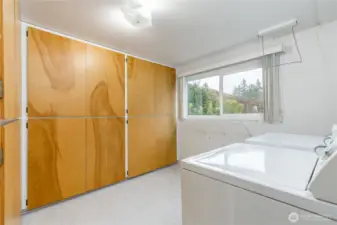 Generous laundry room with tons of storage