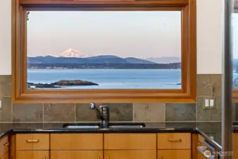 Kitchen perfectly positioned to capture stunning water and mountain views, turning everyday moments into something extraordinary.