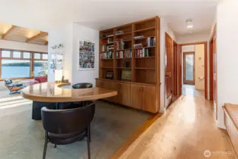 Dedicated office or library space with custom built-ins and warm wood finishes, ideal for work, study, or quiet retreat.