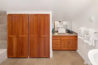 Functional and well-appointed bath with generous storage and clean finishes, thoughtfully designed for both comfort and convenience.