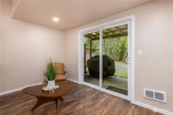 Basement. Patio sliding door leads out to back yard and water