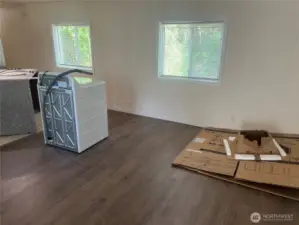 Living room with new vinyl flooring.