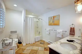 NEW main bath w/double vanity, cabs, bath/tub surround, lighting package and designer fixtures.