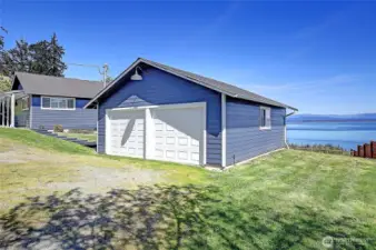 Abundant, oversized 2 car garage w/shop area and ready for your boat on 2nd lot. NEW paint and siding w/plenty of parking for all!
