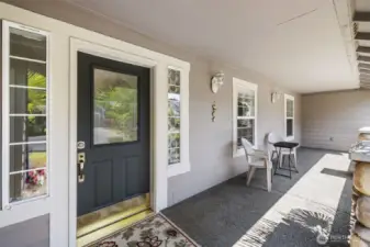 Inviting and expansive covered front porch entrance.