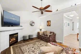 The family room with natural gas fireplace off the kitchen is a wonderful hub of the home.