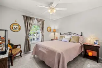 Second bedroom with ceiling fan. Newer carpet.
