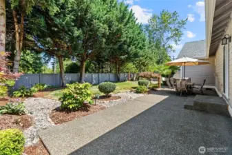 Large aggregate entertaining patio with flagstone paver paths to extend your gatherings outdoors.