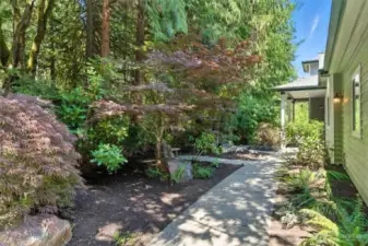 Beautifully landscaped path welcomes you to the front door