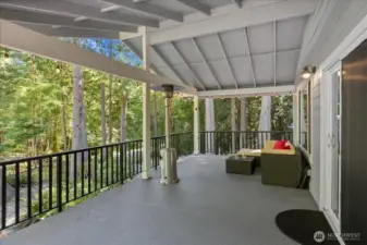 Huge covered deck great for entertaining or enjoying nature year round.