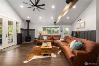 The addition was thoughtfully designed with this grand family room, outdoor kitchen and deck space just out the french doors on the left.