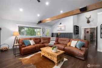 Plenty of room to lounge and relax! Kitchen and dining room through door in background.