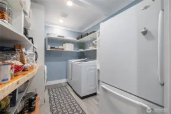 Pantry has laundry plus an extra refrigerator and is located just across the hall from the kitchen, making daily chores a breeze.