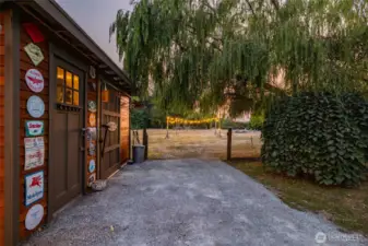 Shed to the left holds all your toys and tools. Your personal park is beyond... there is also a barn on the property currently used as a shop and storage space.