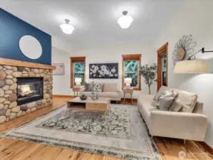 Living room with double sided gas fireplace.