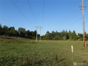 Property line follows the South edge of Powerline easment