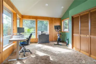 First bedroom located in the front left corner of the home with several windows allowing beautiful natural light to enter. Currently set up as home office/workout room.