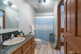 Second hallway bathroom with shower/tub combo and door to 2nd bedroom. Could be used as a guest suite.