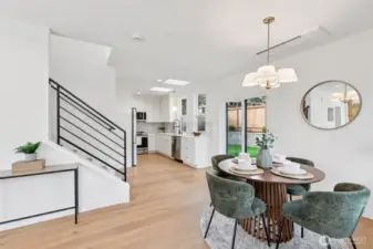 Living and dining rooms flow to kitchen. Glass doors open to private fence back yard - great space for entertaining