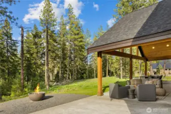 Large covered back patio up against the conservancy.