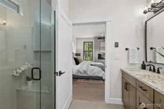 Primary bathroom with walk in shower and closet.