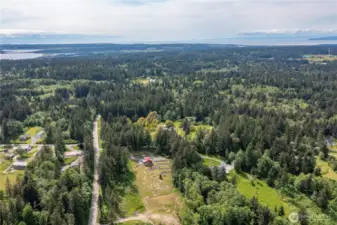 Beautiful view of the home with the property stretching out in front. This is island living at it's best, with state parks, beaches, boating, fishing, walking trails and so much more at your fingertips.
