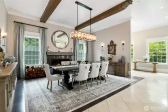 The formal dining room features wood-beamed ceilings and Italian marble flooring—an inviting space to host and gather.