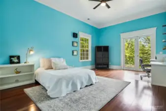 One of 5 upper level bedrooms - this bedroom features French door access to the balcony and a jack-and-jill bathroom shared with another bedroom.
