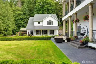 Detached 3 car garage with 2 bedroom/1 bath carriage house atop. A dedicated fenced dog run and spacious heated doghouse comfortably accommodate up to three dogs, while an in-ground wire collar system spans the entire property—giving your dogs the freedom to roam safely within the boundaries of home.