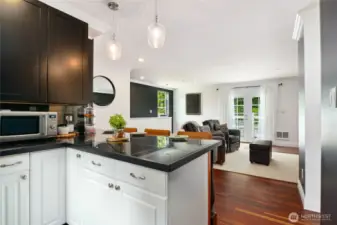 The kitchenette is thoughtfully designed to meet all culinary needs, making meal prep easy and enjoyable. A private entrance ensures independence and convenience, while a secluded patio provides the perfect spot for relaxing. French doors open onto a charming balcony, offering a peaceful place to unwind while taking in the surrounding views.