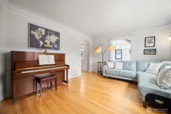 The wood floor was meticulously refurbished to shine the rich natural hues of the wood.  Light and airy with the charming doorways showing the depth of the vintage character this home offers. Come fall in love with craftsmanship that we rarely see in current homes.