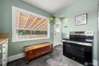 Back door entry allow easy access to cars and fenced back yard.  There is a handy space to hang coats and leave your shoes right by the door.  Space also for a small sitting bench. for company to sit and visit in the kitchen or a place you can easily places shoes off and on, or use the sitting area for setting down your shopping, or organizing your items for the day.