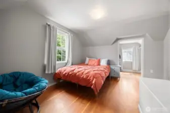Another upper floor bedroom with a large walk in closet that is big enough for a secret cubby for play or reading a good book.