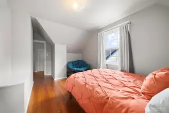 2nd view of the bedroom with some nice angles from the roof line.  Enjoy the incredible beauty of the natural wood flooring.