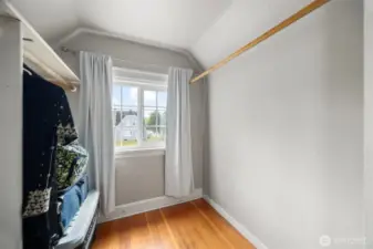 Large walk in close off the bedroom sports natural light bright window. This space is great storage space or could be a secret cubby to read, rest, take in the morning at the start of the day.
