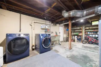 Basement area has the washer dryer hook up, access from outside carport area, and great storage for gear and toys.  This open space also offers additional room for play or work.