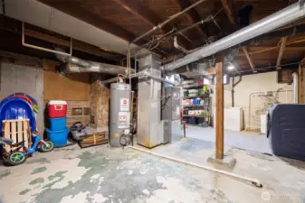 Large storage space in this basement lower level that is accessible from outside as well as from the inside of the house.  Leave as is or do more cosmetic finish work for additional living/play/work space.