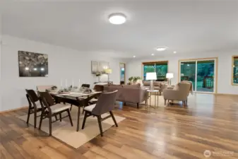 open concept common area staged with dining and living area