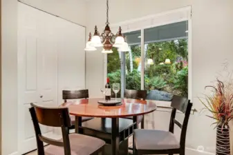 Kitchen eating area with windows to enjoy the landscape.
