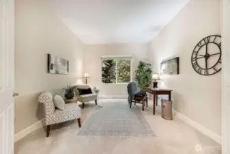 Office area and or study with windows to enjoy lush greenery.