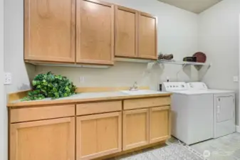 So much storage space in the utility room. Immediate access to the 2 car garage that also has an abundance of storage.