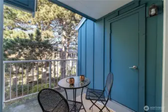 Mostly covered private deck with storage