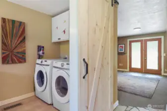Laundry, located withing half bath, washer & dryer transfer with sale. Old shower plumbing still remains, if you want to add a shower and relocate the washer & dryer.