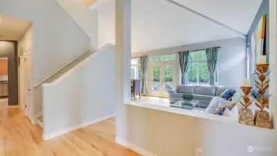 Once you enter the home you instantly feel the openness and light filled rooms.  The soaring vaulted ceilings, large windows and skylights keep the home bright and airy.  The hardwood floors are throughout most of the home.