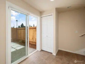 Inviting foyer with a coat closet and access to the patio and garage. Photo shows Unit B (MLS 2276317) with reversed identical floor plan.