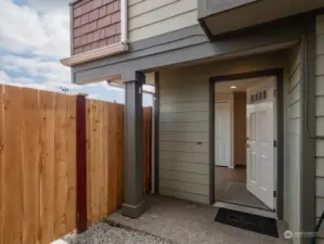 Main entrance with a covered porch. Photo shows Unit B (MLS 2276317) with reversed identical floor plan.