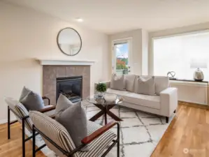 Bright and cozy living room with a gas fireplace and a balcony with territorial views. Photo shows Unit B (MLS 2276317) with reversed identical floor plan.