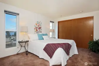Primary Bedroom with groovy mauve carpet.