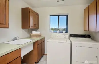 Laundry room includes a large sink.