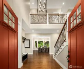 Grand Entry with soaring ceilings, gleaming hardwood floors and designer lighting.